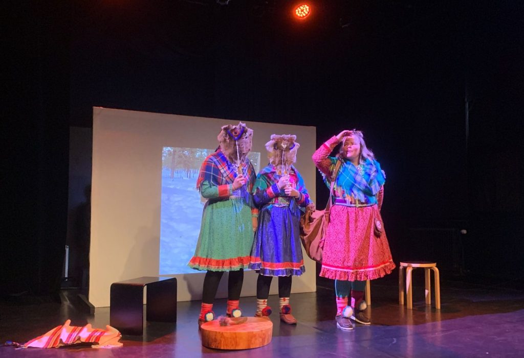 the picture shows Sámi artist, Petra Biret, performing a Yoik show at Annantalo