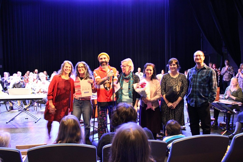2025 Intersectional Award Ceremony. The picture shows the stage of Malmitalo full of musicians and Kulttuurikeskus Ninho team receiving this award