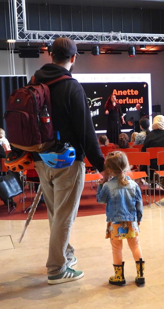 A father and her daughter enjoying Anette Akerlund concert at Sello Library